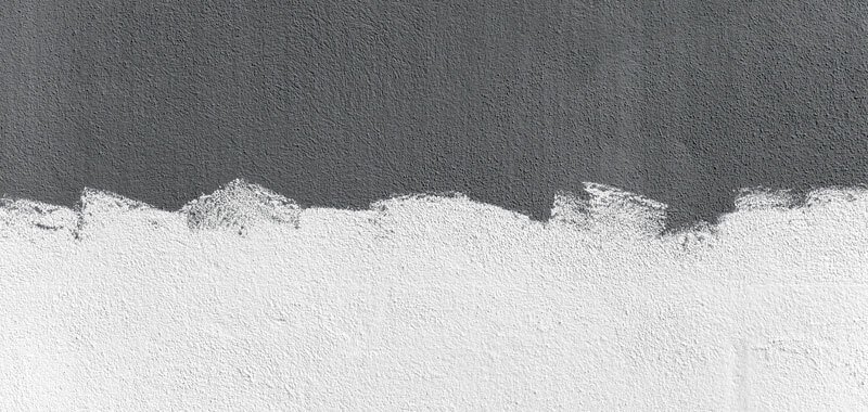 Concrete wall painted half gray half white